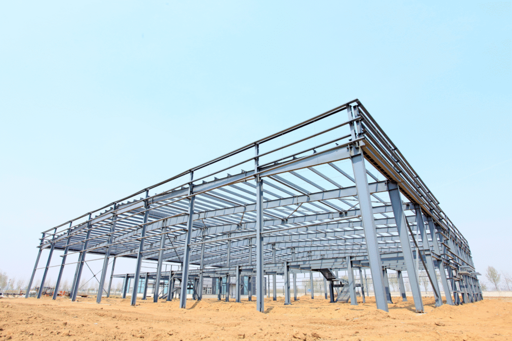 Steel frame construction in an open area, showcasing structural design for building projects, relevant to Ossett construction services.